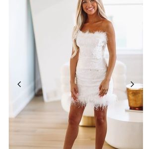 BRAND NEW. Hazel and Olive White short strapless dress with feathers.